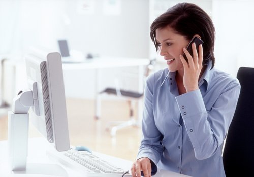 A woman speaks on the phone from Carpet Depot in Denver